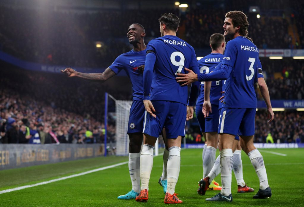 Antonio Rudiger celebrates scoring their first goal with Marcos Alonso, Alvaro Morata and team mates.