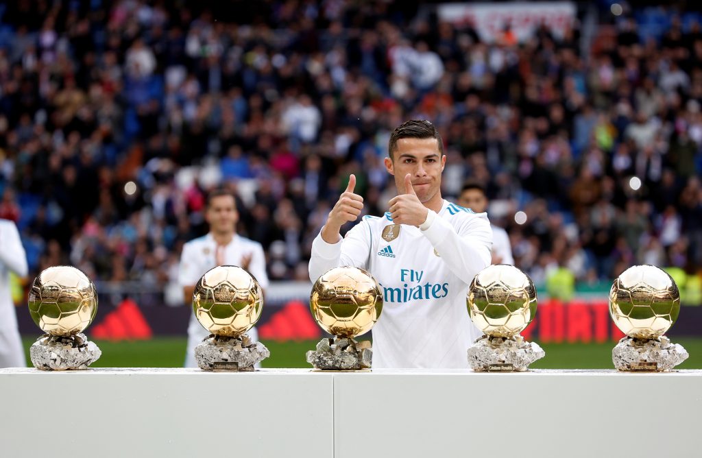 Real Madrids Cristiano Ronaldo with his five Ballon d'Or trophies before the match.