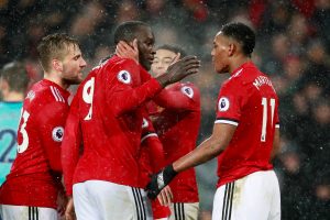 Manchester United's Romelu Lukaku celebrates scoring their first goal with team mates.