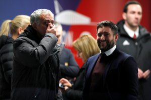 Jose Mourinho speaks with Bristol City manager Lee Johnson.