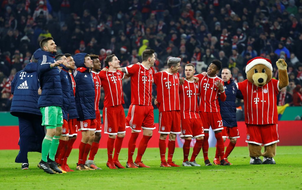 Bayern Munich players line up in celebration after the match.