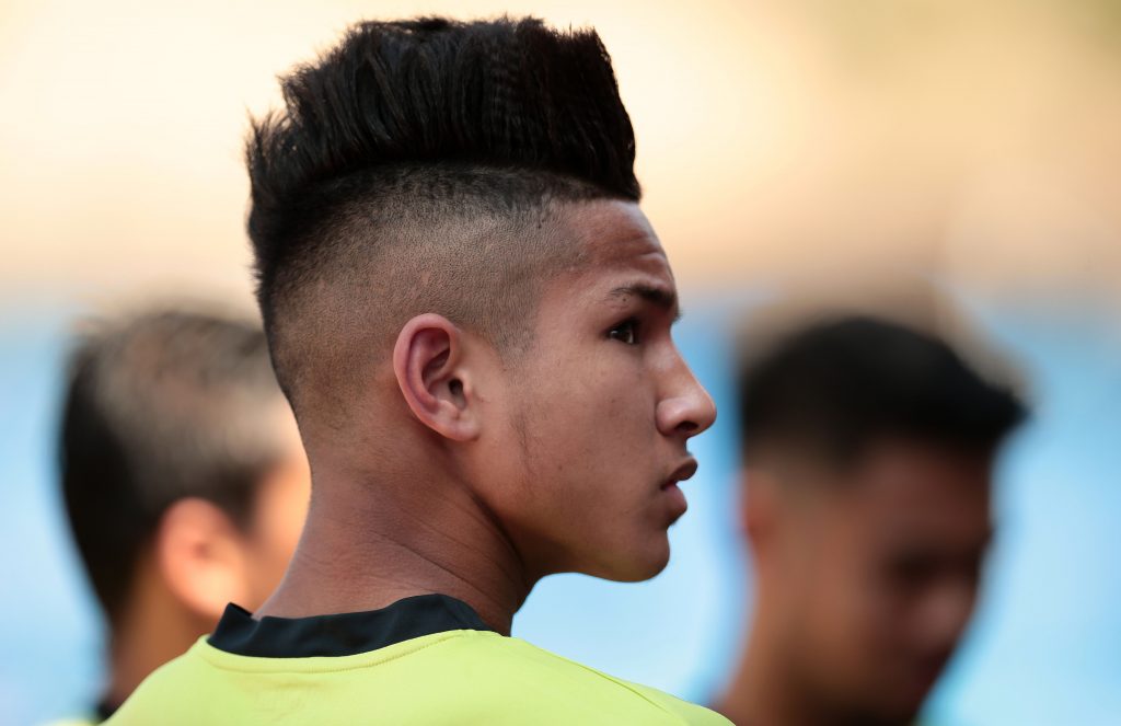 Brunei's Faiq Jefri Bolkiah, nephew of the Sultan of Brunei, warms up before the match.