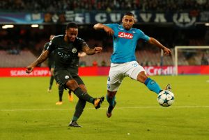 Man City's Raheem Sterling in action with Napoli's Faouzi Ghoulam.