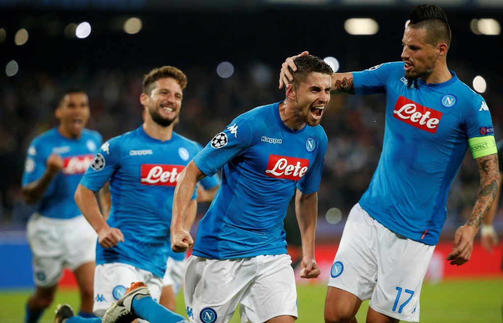 Napoli's Jorginho celebrates scoring their second goal with Marek Hamsik (R) and team mates.