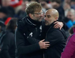Jurgen Klopp shakes hands with Pep Guardiola after the match.