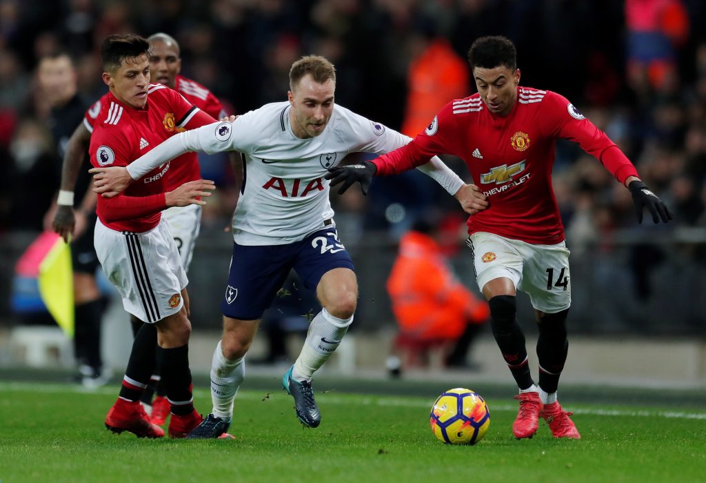 Tottenham's Christian Eriksen in action with Alexis Sanchez and Jesse Lingard.