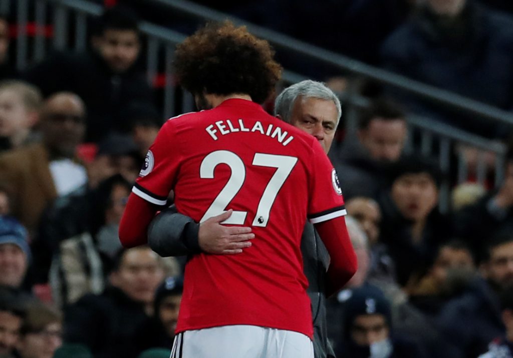 Marouane Fellaini gets a hug from manager Jose Mourinho as he is substituted shortly after coming on.