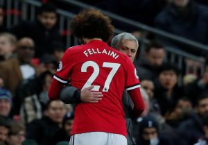 Marouane Fellaini gets a hug from manager Jose Mourinho as he is substituted shortly after coming on.