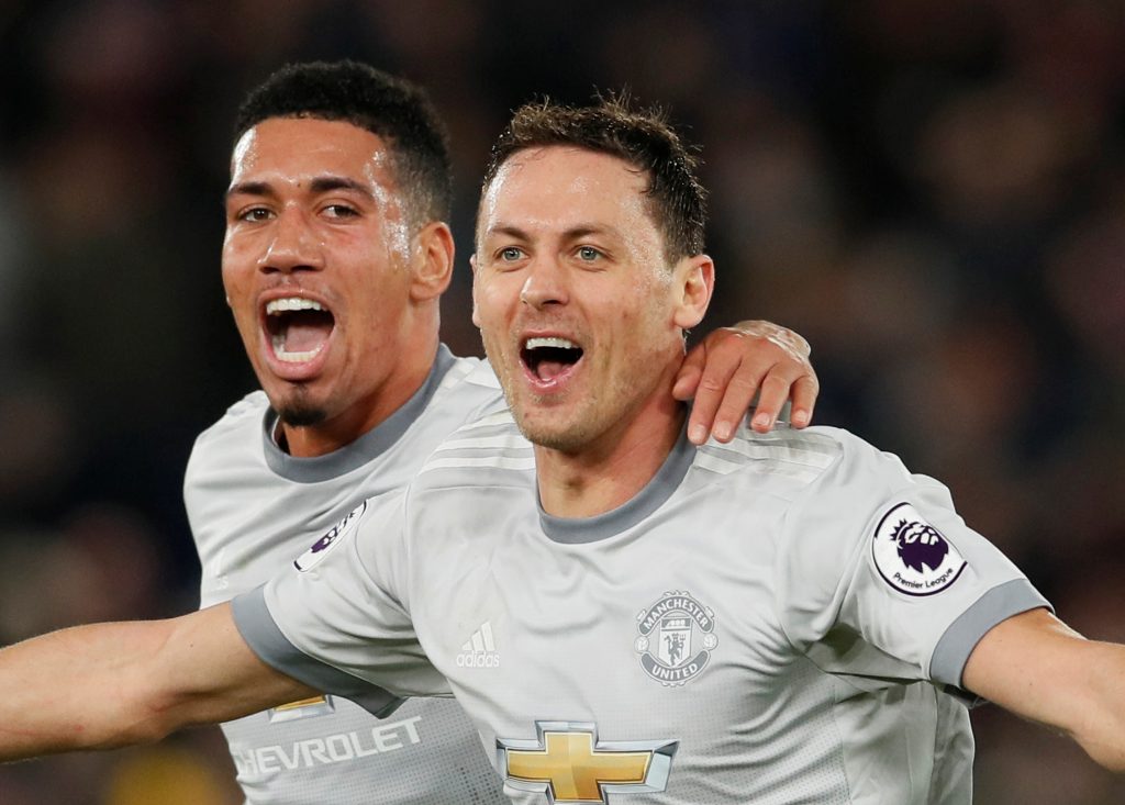 Manchester United's Nemanja Matic celebrates scoring their third goal with Chris Smalling.