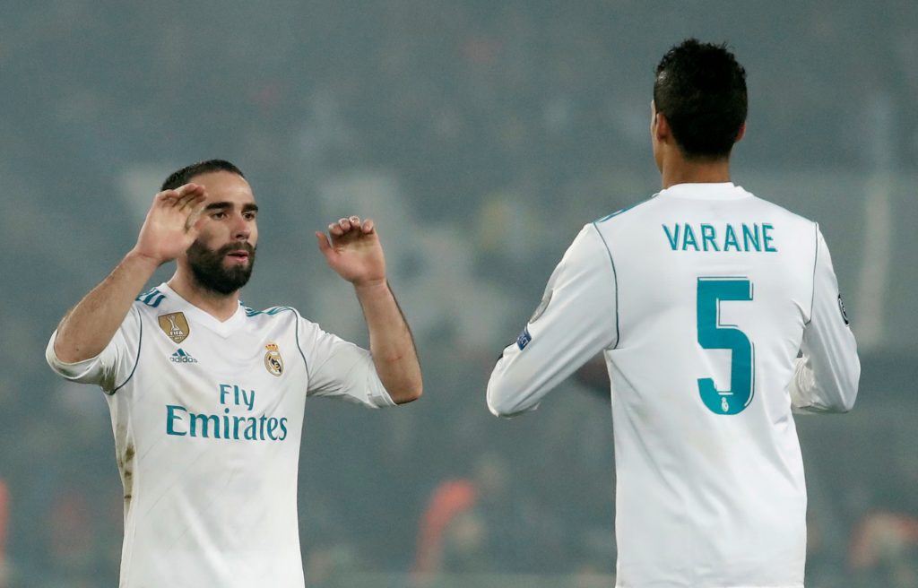 Real Madrids Dani Carvajal and Raphael Varane celebrate after the match.