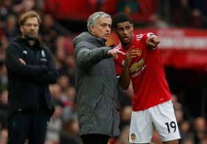 Manchester United manager Jose Mourinho gives instructions to Marcus Rashford.