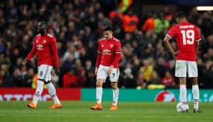 Romelu Lukaku and Alexis Sanchez look dejected.