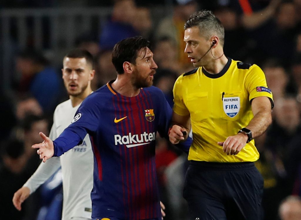 Barcelonas Lionel Messi speaks with referee Damir Skomina.