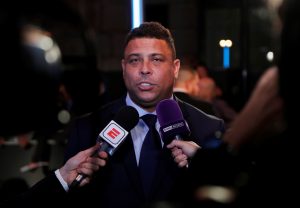 Former Brazil player Ronaldo is interviewed before the start of the awards.