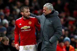 Jose Mourinho speaks with Luke Shaw as he is substituted off.