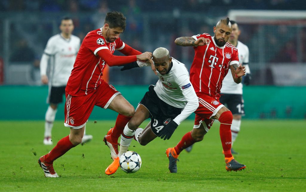 Besiktas' Anderson Talisca in action with Bayern Munich's Javi Martinez and Arturo Vidal.