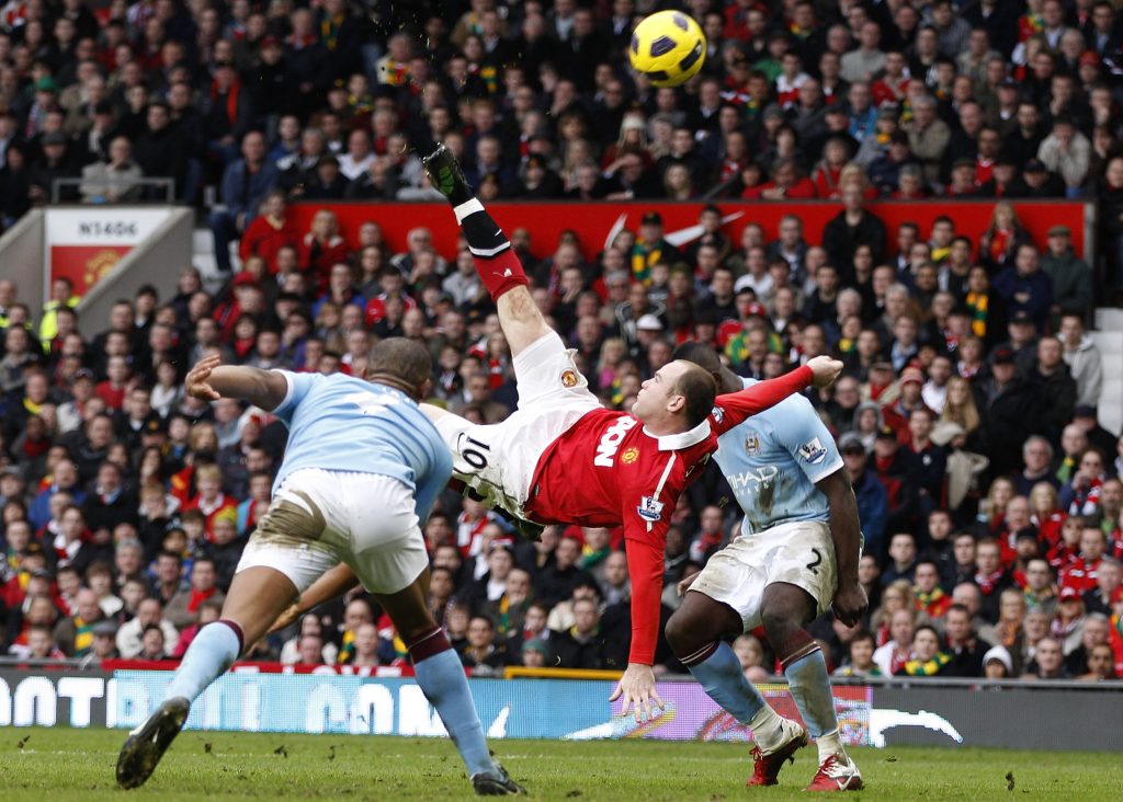 Wayne Rooney scores against Man City from an overhead kick during their Premier League soccer match.