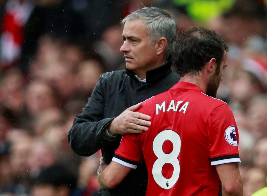 Juan Mata with Jose Mourinho after being substituted.