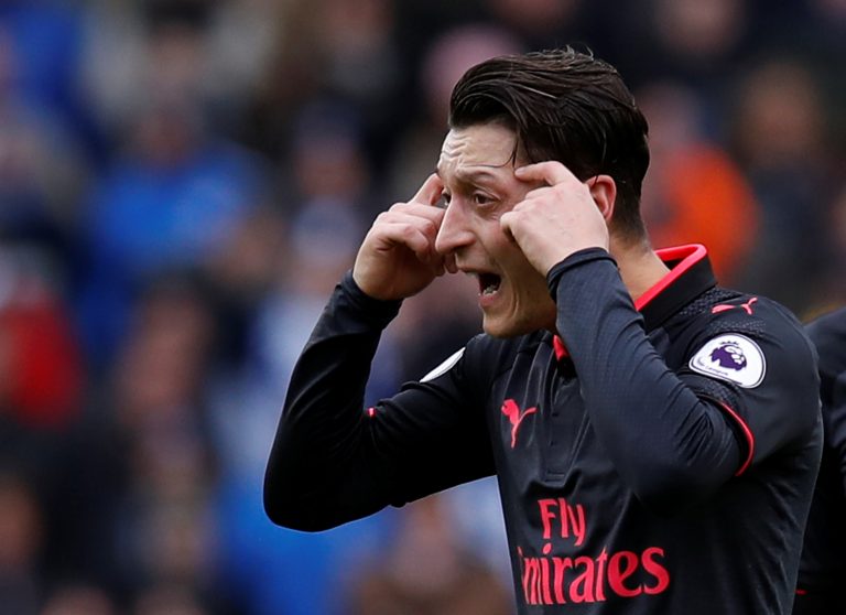 Arsenal's Mesut Ozil looks dejected after Brighton's second goal scored by Glenn Murray.
