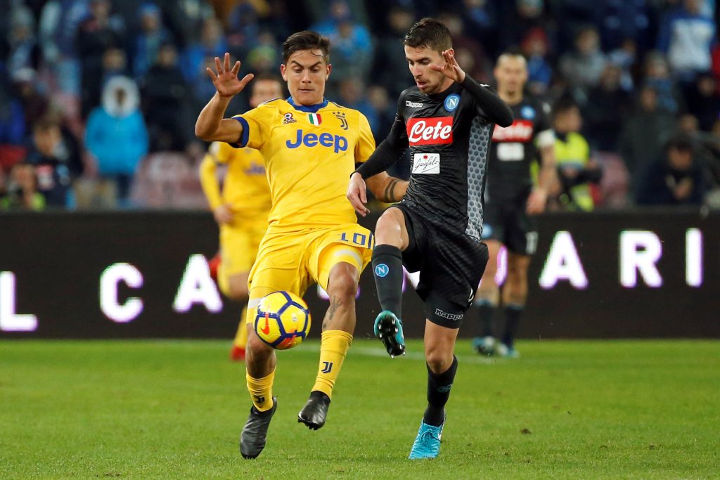 Juventus Paulo Dybala in action with Napoli's Jorginho.