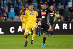 Juventus Paulo Dybala in action with Napoli's Jorginho.