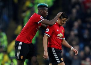 Alexis Sanchez is substituted off as Paul Pogba looks on.