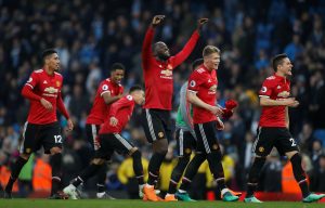 Manchester United's Romelu Lukaku and team mates celebrate after the match.