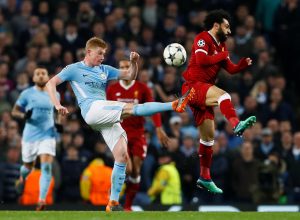 Man City's Kevin De Bruyne in action with Liverpool's Mohamed Salah.