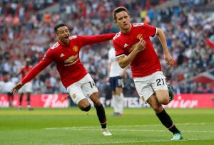 Manchester United's Ander Herrera celebrates scoring their second goal with Jesse Lingard.