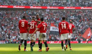 Manchester United's Ander Herrera celebrates scoring their second goal with teammates.