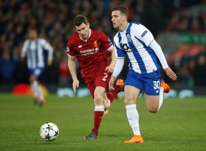 Porto's Diogo Dalot in action with Liverpool's James Milner.
