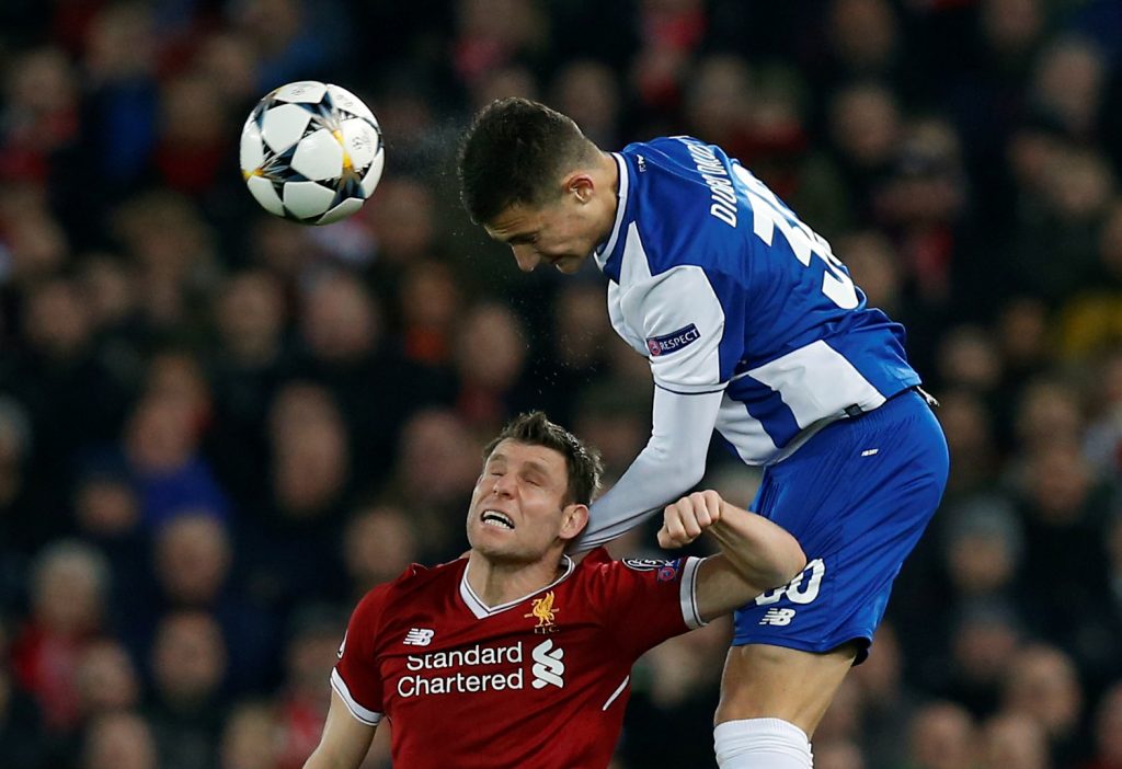 Porto's Diogo Dalot in action with Liverpool's James Milner.