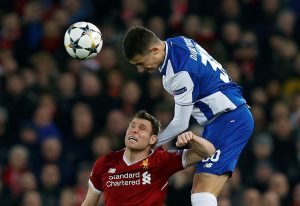 Porto's Diogo Dalot in action with Liverpool's James Milner.