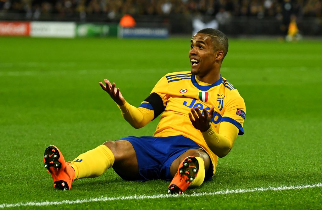 Juventus Douglas Costa reacts after he is not awarded a penalty.