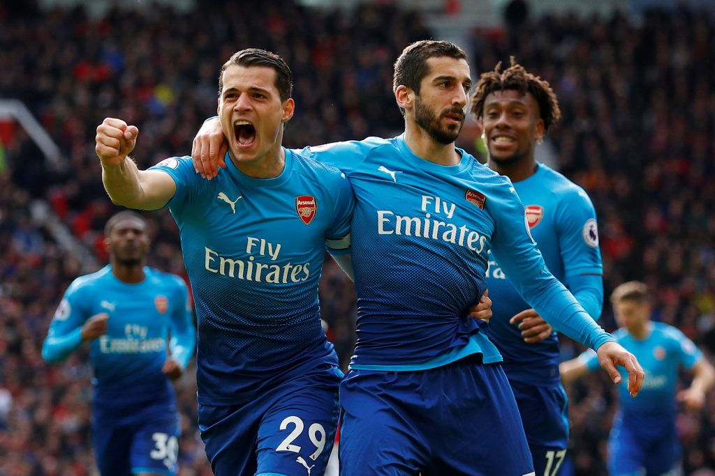 Arsenal's Henrikh Mkhitaryan celebrates scoring their first goal with Granit Xhaka and Alex Iwobi.