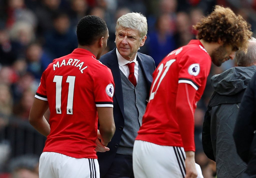 Manchester United's Anthony Martial shakes hands with Arsenal manager Arsene Wenger before coming on as substitute.