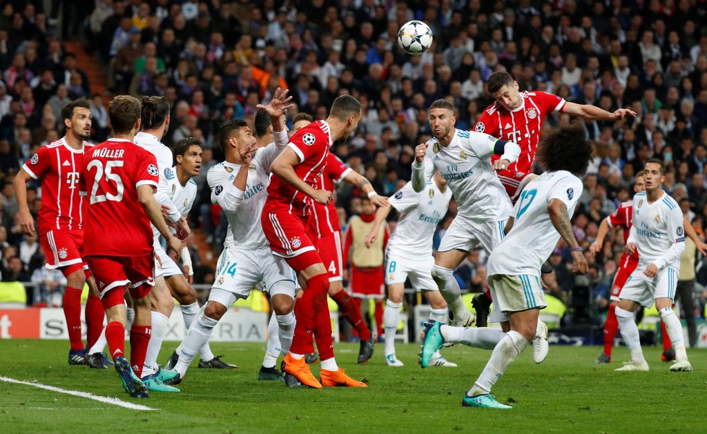 Bayern Munich's Robert Lewandowski heads at goal.