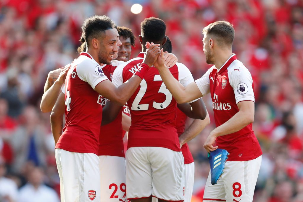 Arsenal's Pierre-Emerick Aubameyang celebrates scoring their fifth goal with Aaron Ramsey and team mates.
