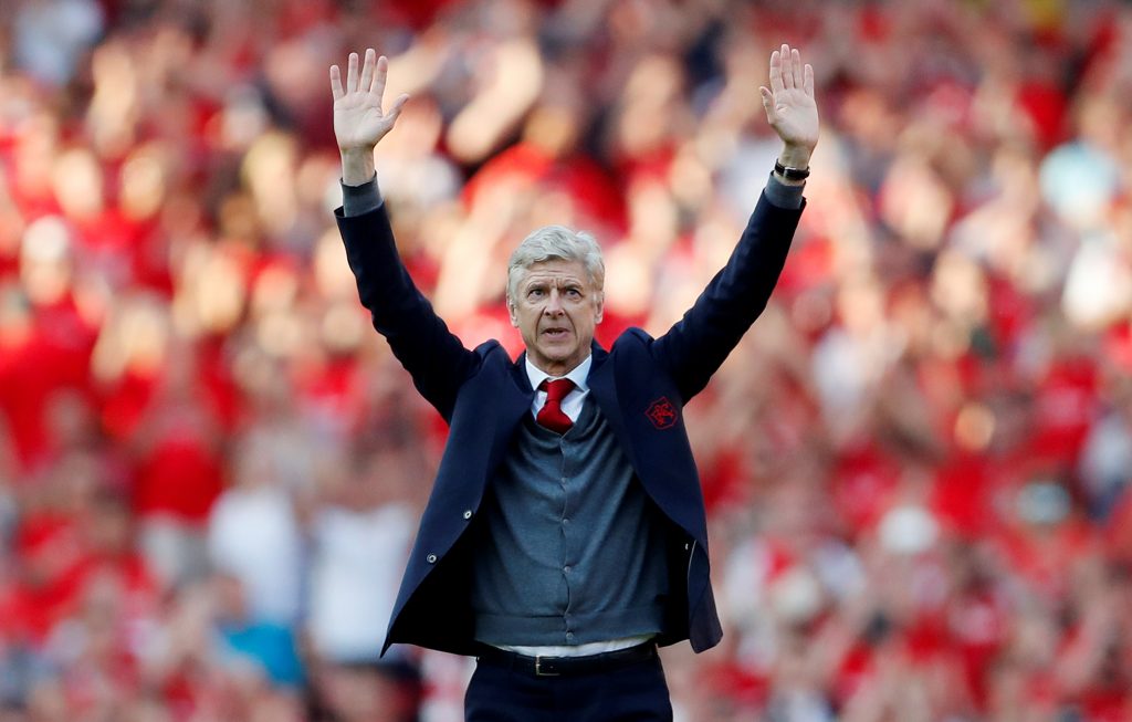 Arsenal manager Arsene Wenger waves to the fans after the match.