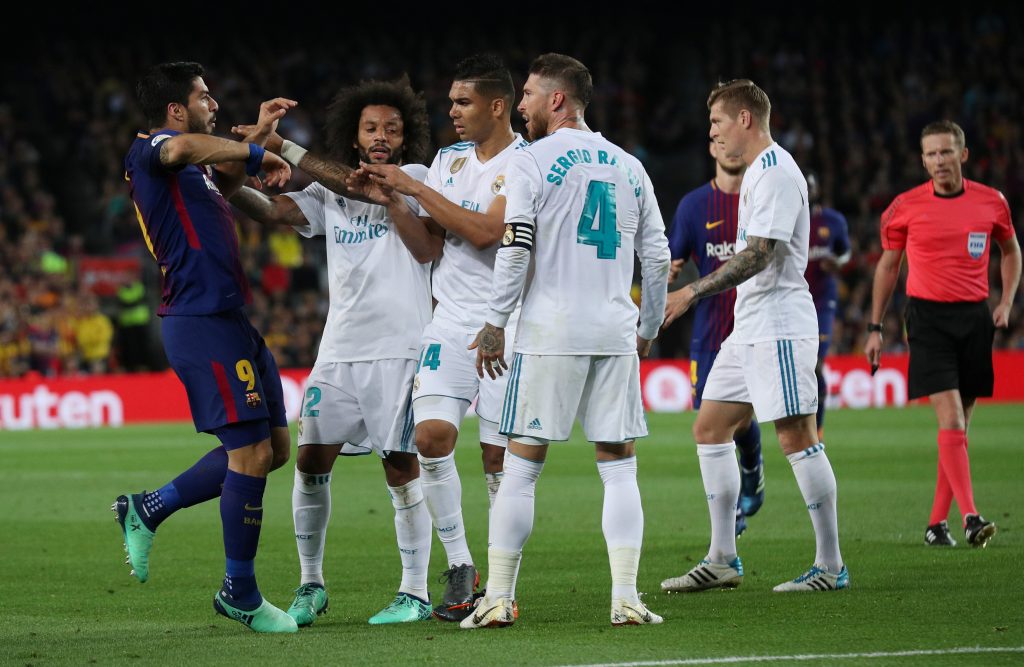 Barcelona's Luis Suarez clashes with Real Madrid's Casemiro, Sergio Ramos and Marcelo.