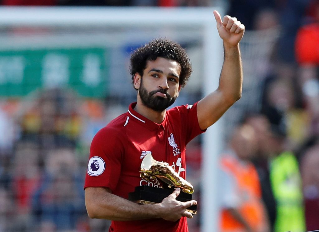 Liverpool's Mohamed Salah celebrates with the Golden Boot after the match.