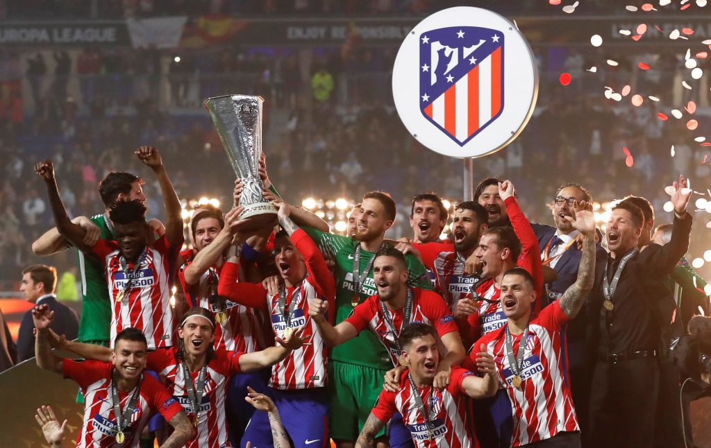 Atletico Madrid's Gabi and Fernando Torres lift the trophy as they celebrate winning the Europa League.