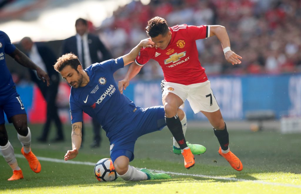 Manchester United's Alexis Sanchez in action with Chelsea's Cesc Fabregas.