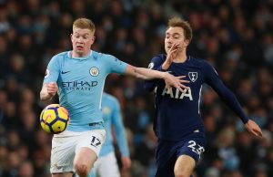 Manchester City's Kevin De Bruyne in action with Tottenham's Christian Eriksen.