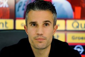 Robin van Persie attends a news conference.