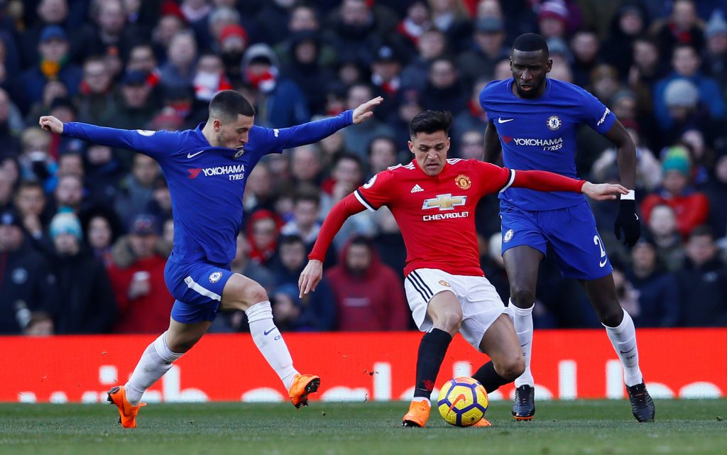 Manchester Uniteds Alexis Sanchez in action with Chelsea's Eden Hazard and Antonio Rudiger.