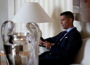 Real Madrid's Cristiano Ronaldo with the Champions League trophy during a ceremony.