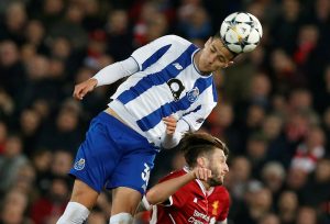 Porto's Diogo Dalot in action with Liverpool's Adam Lallana.