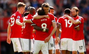 Manchester United's Marcus Rashford celebrates scoring their first goal with Manchester United's Michael Carrick, Juan Mata and team mates.