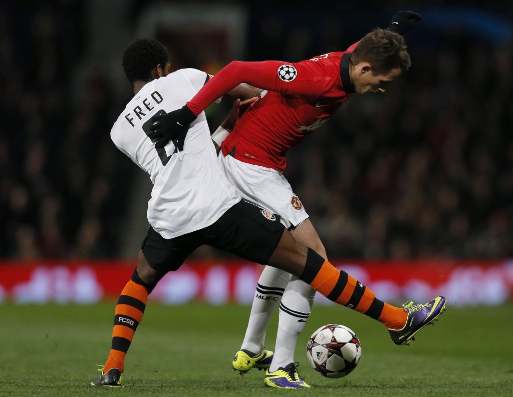 Adnan Januzaj (R) is challenged by Shakhtar Donetsk's Fred during their Champions League soccer match at Old Trafford.